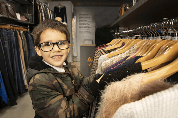 young boy shopping in his local EHAAT charity shop