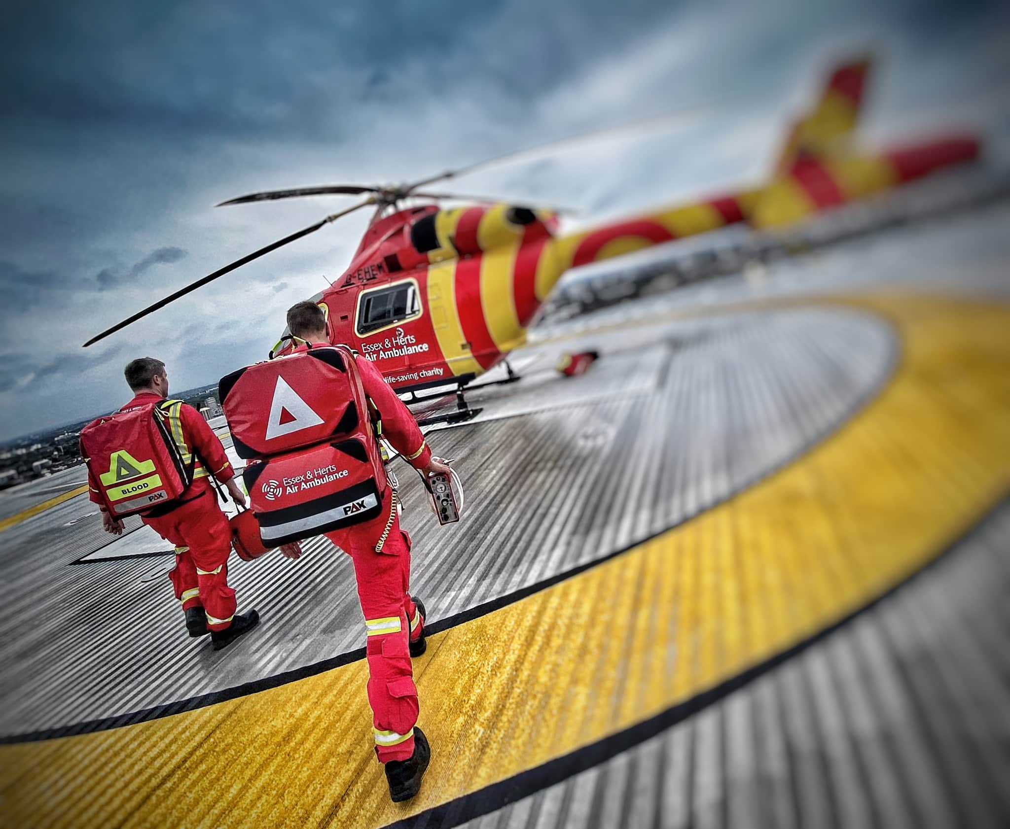 Paramedic and Doctor walking towards the helicopter on London Hospital roof after a mission
