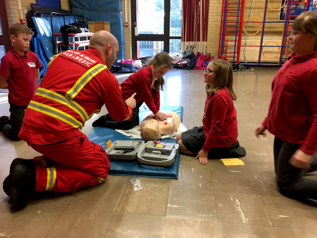 Air Ambulance week, Adam teaching school children basic CPR training