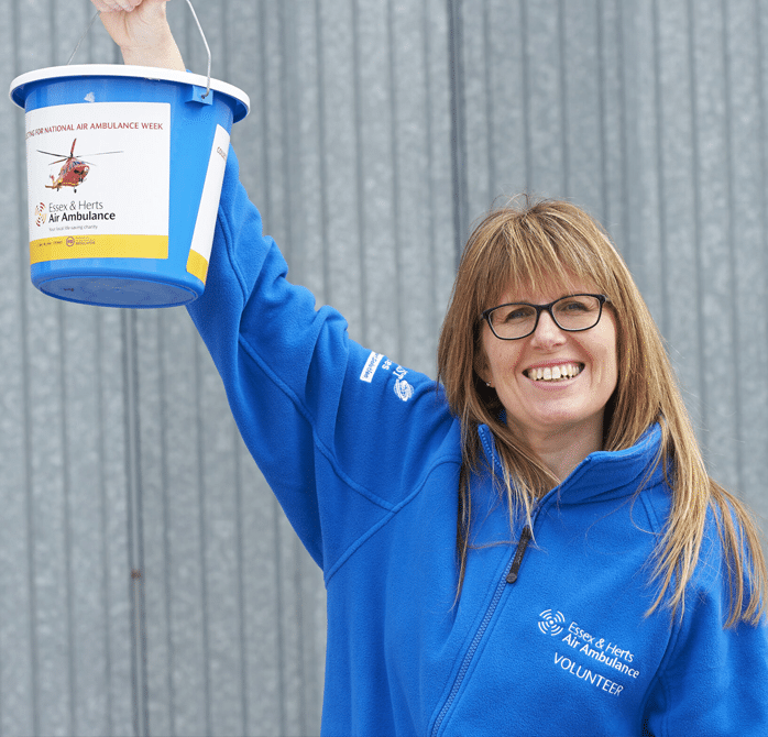 Volunteer with fundraising collection bucket