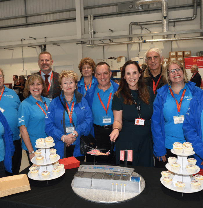 Jane Gurney and volunteers with EHAAT North Weald cake